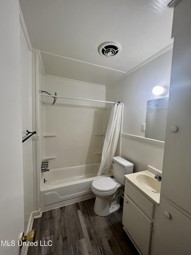 802 Farmer St, Cleveland, MS 38732 - bathroom with wood finished floors, vanity, shower / bath combo with shower curtain, and toilet