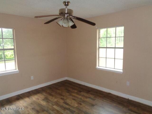 6301 Pioneer Trl, Moss Point, MS 39562 - unfurnished room with dark wood-style flooring and ceiling fan