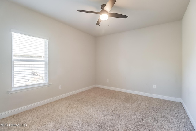 carpeted empty room with ceiling fan