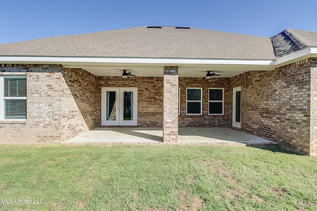 back of house featuring ceiling fan, a patio, french doors, and a lawn