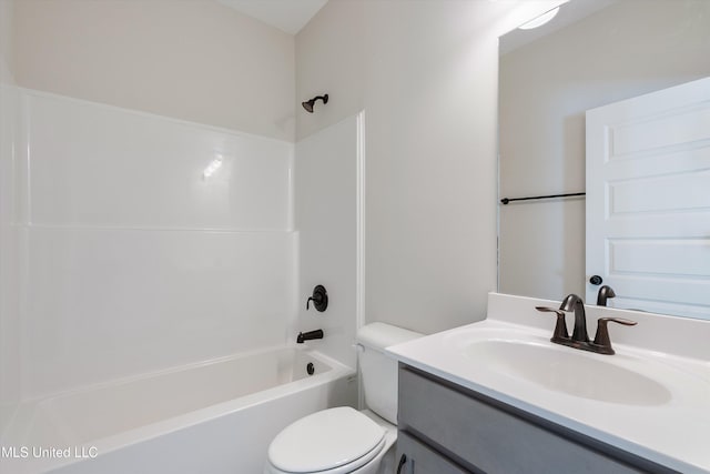 bathroom with bathing tub / shower combination, toilet, and vanity