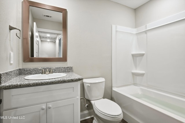 full bathroom featuring vanity, toilet, and  shower combination