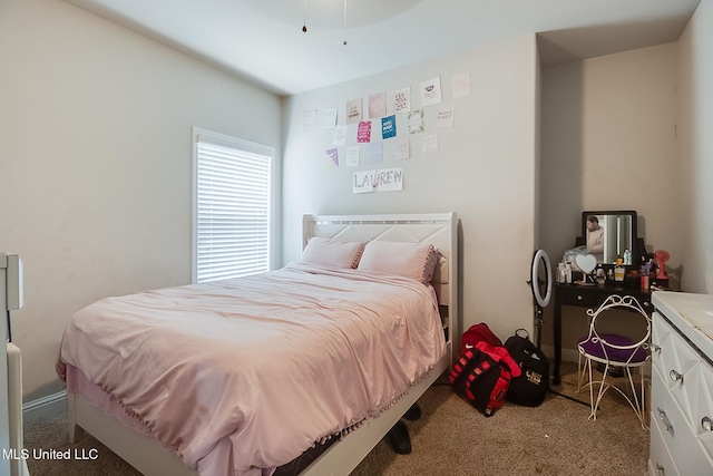 bedroom with light colored carpet