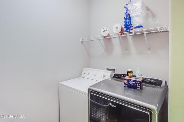 laundry area with separate washer and dryer