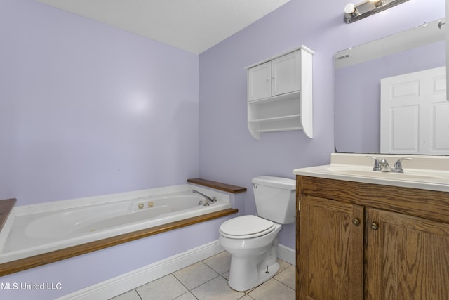 bathroom with tile patterned flooring, baseboards, toilet, a garden tub, and vanity