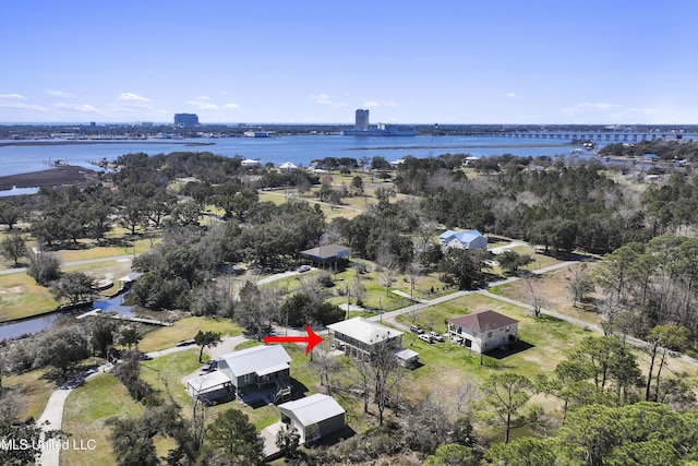 birds eye view of property with a water view