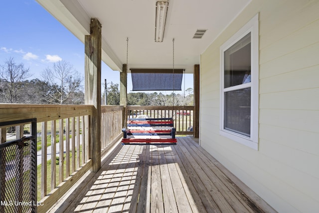 wooden deck with visible vents