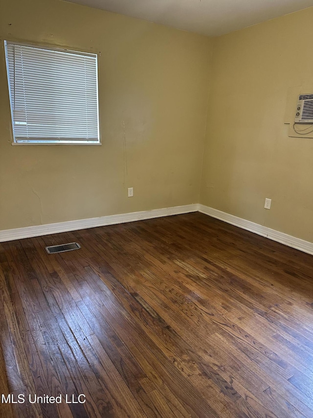 empty room featuring dark hardwood / wood-style floors