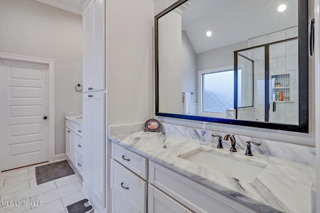 bathroom with tile patterned floors, vanity, and walk in shower