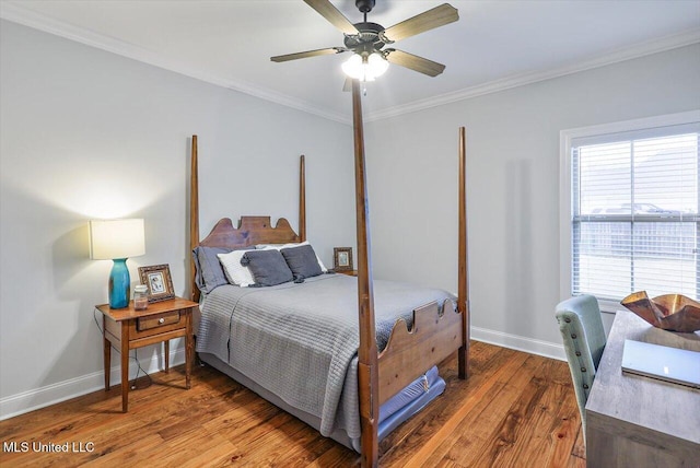 bedroom with ceiling fan, hardwood / wood-style floors, and crown molding