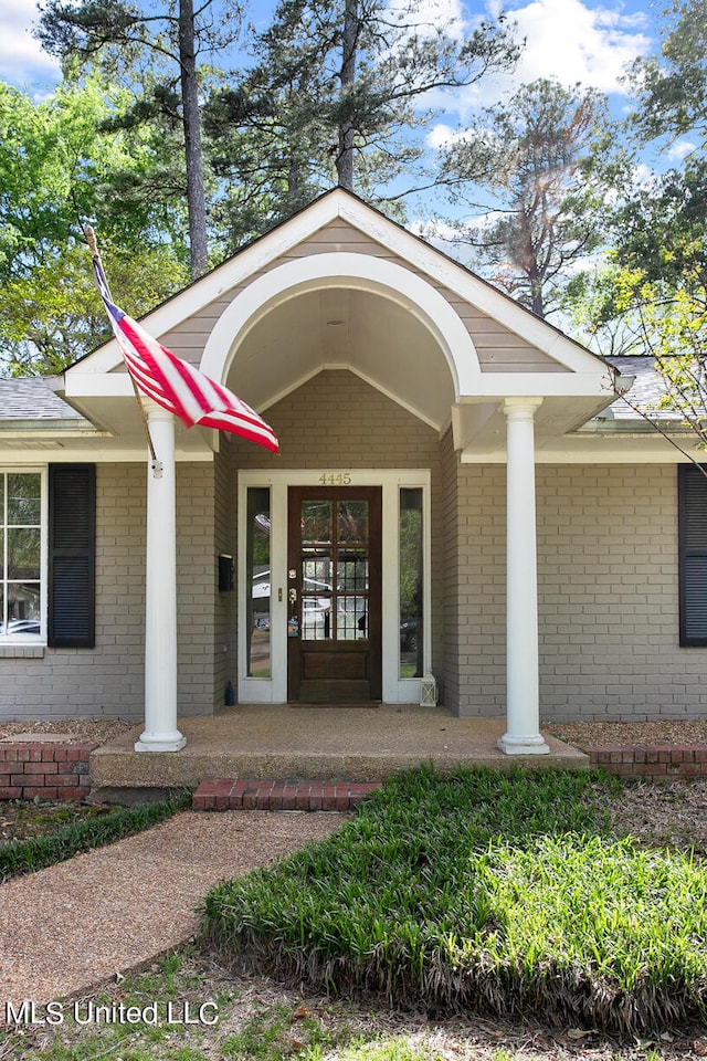 property entrance with covered porch