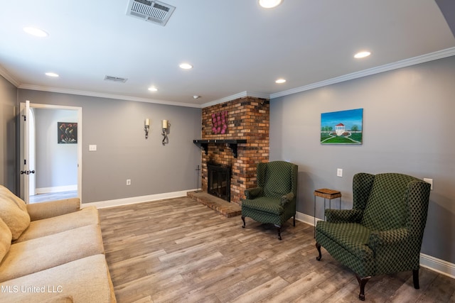 211 Traceway Dr, Natchez, MS 39120 - living area with recessed lighting, light wood-style floors, crown molding, and a brick fireplace