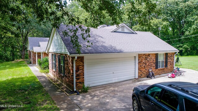 211 Traceway Dr, Natchez, MS 39120 - view of front of property with brick siding, a front lawn, a shingled roof, a garage, and view of scattered trees