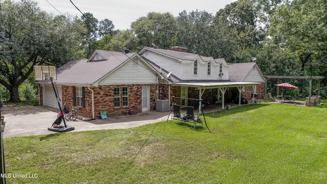 211 Traceway Dr, Natchez, MS 39120 - back of house featuring a patio area, brick siding, a garage, concrete driveway, and a lawn