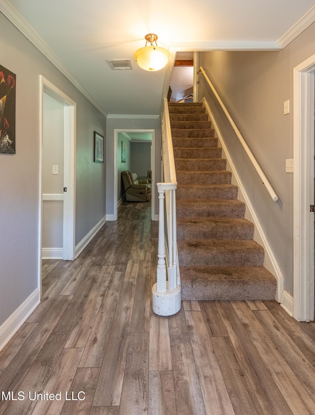 211 Traceway Dr, Natchez, MS 39120 - stairway featuring wood finished floors and crown molding