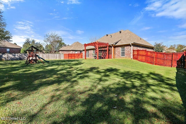 view of yard with a playground and a pergola