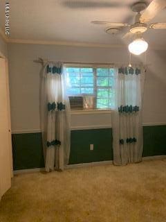 1030 Adkins Blvd, Jackson, MS 39211 - spare room featuring a ceiling fan, carpet floors, and ornamental molding