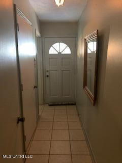 1030 Adkins Blvd, Jackson, MS 39211 - doorway to outside with light tile patterned floors and healthy amount of natural light