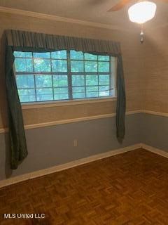 1030 Adkins Blvd, Jackson, MS 39211 - spare room with baseboards, ceiling fan, and crown molding