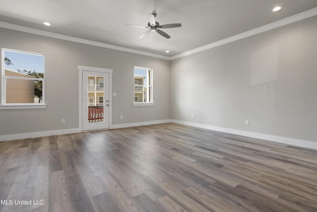 unfurnished room featuring plenty of natural light, crown molding, recessed lighting, a ceiling fan, and wood finished floors