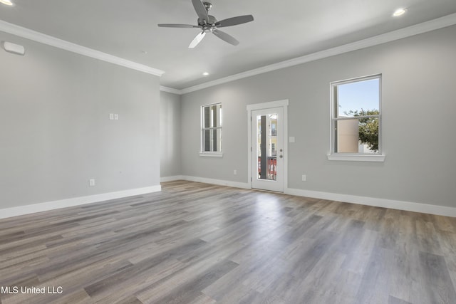 unfurnished living room featuring ornamental molding, recessed lighting, ceiling fan, baseboards, and wood finished floors