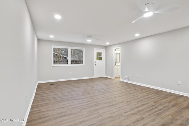 unfurnished room featuring wood-type flooring and ceiling fan