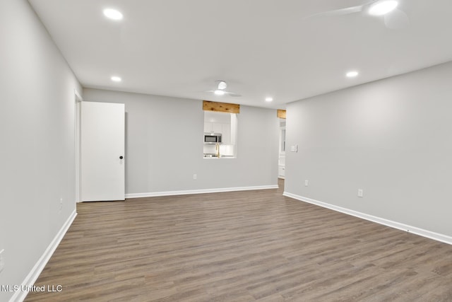 interior space with hardwood / wood-style flooring and ceiling fan