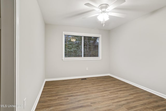 empty room with wood-type flooring and ceiling fan