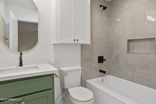 full bathroom with vanity, toilet, and tiled shower / bath