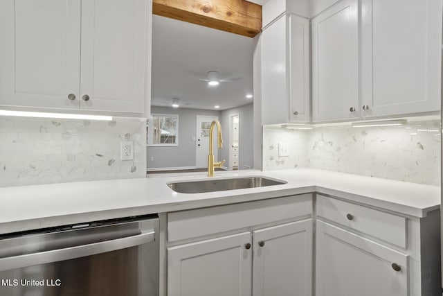 kitchen with white cabinetry, dishwasher, sink, and backsplash