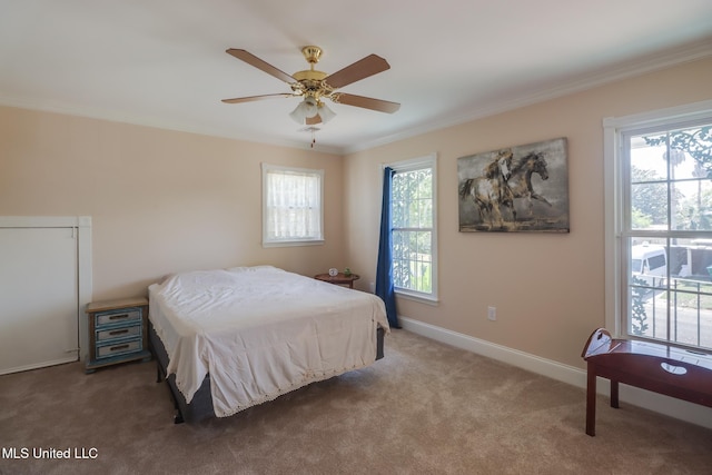 bedroom featuring baseboards, ornamental molding, a ceiling fan, and carpet floors
