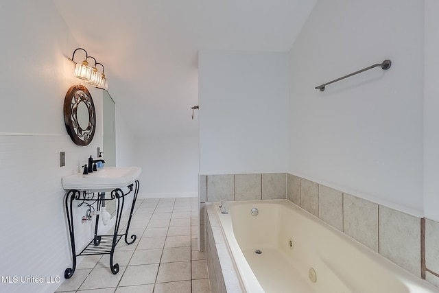 bathroom featuring lofted ceiling, tiled bath, and tile patterned flooring