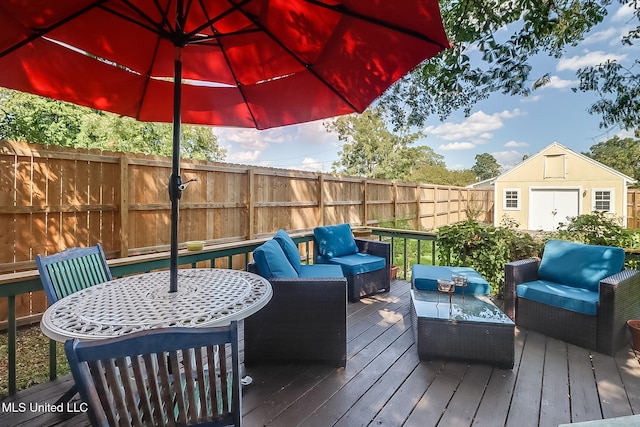 wooden deck with outdoor lounge area and a shed