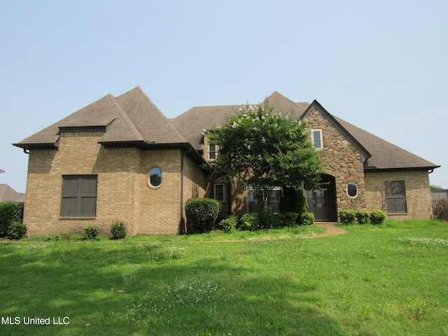 3542 Marcia Louise Dr, Southaven, MS 38672 - view of front of property featuring a front yard, brick siding, and a shingled roof