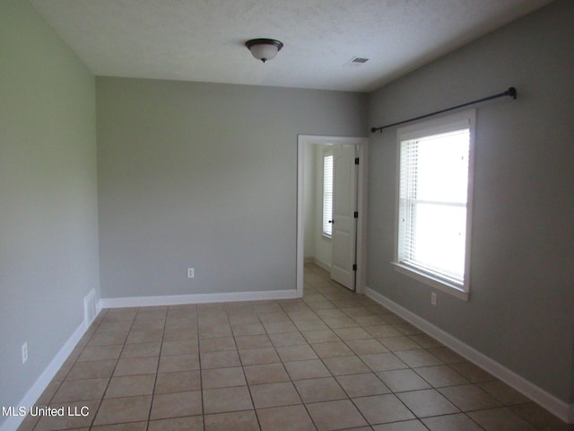 3542 Marcia Louise Dr, Southaven, MS 38672 - unfurnished room with baseboards and light tile patterned flooring