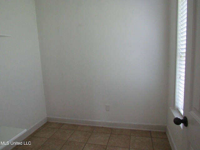 3542 Marcia Louise Dr, Southaven, MS 38672 - empty room featuring baseboards and light tile patterned floors