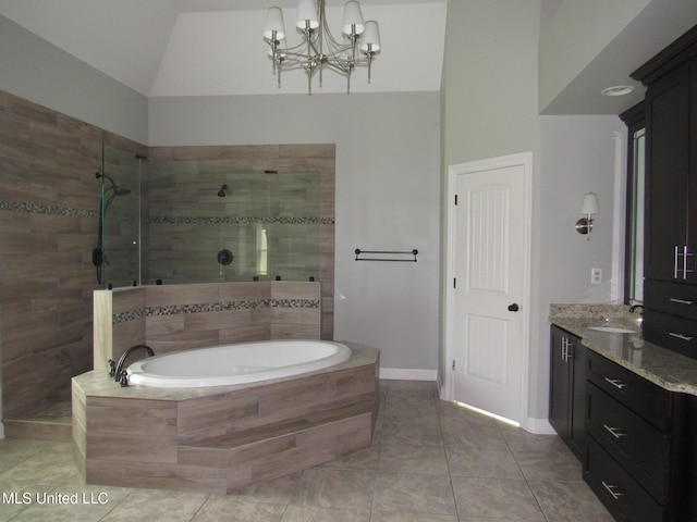 3542 Marcia Louise Dr, Southaven, MS 38672 - full bathroom featuring a bath, walk in shower, a chandelier, vanity, and high vaulted ceiling