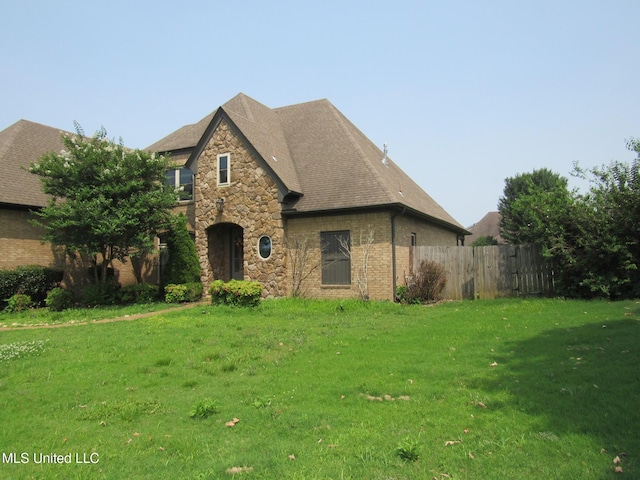3542 Marcia Louise Dr, Southaven, MS 38672 - view of front of property featuring stone siding, roof with shingles, and brick siding