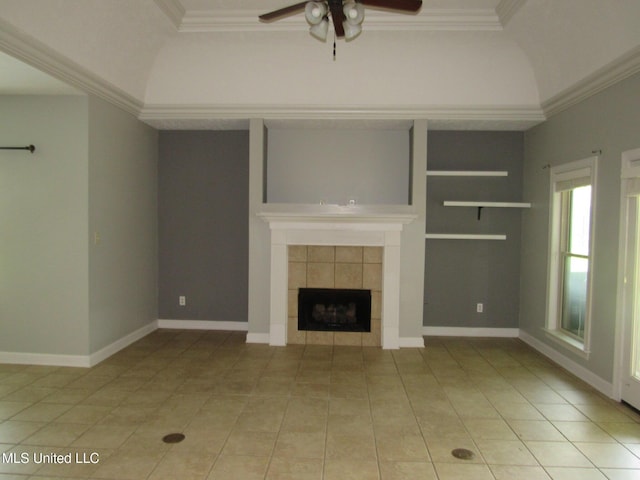 3542 Marcia Louise Dr, Southaven, MS 38672 - unfurnished living room with a ceiling fan, light tile patterned floors, ornamental molding, a raised ceiling, and a fireplace
