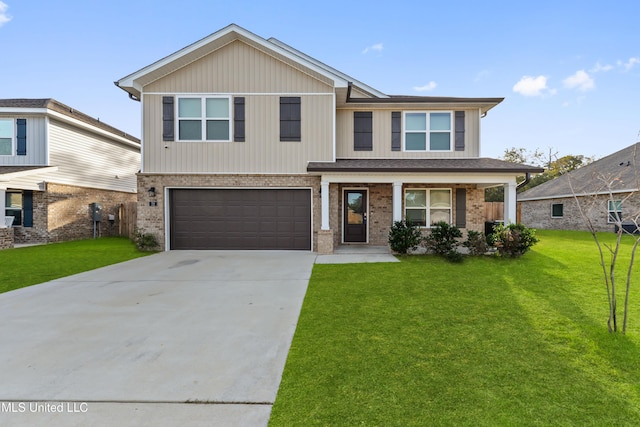 view of front of property featuring a garage and a front lawn