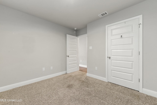 unfurnished bedroom with carpet