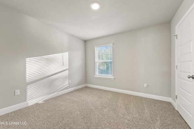 unfurnished room featuring carpet floors