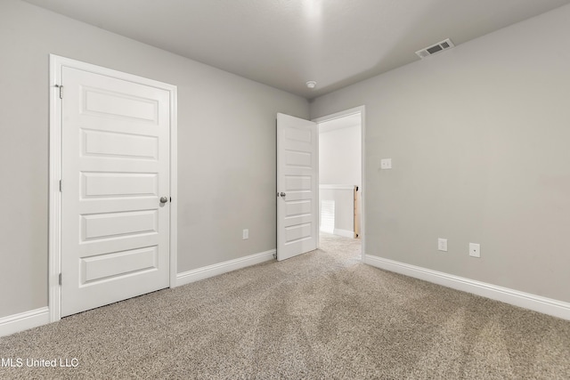 unfurnished bedroom with carpet floors