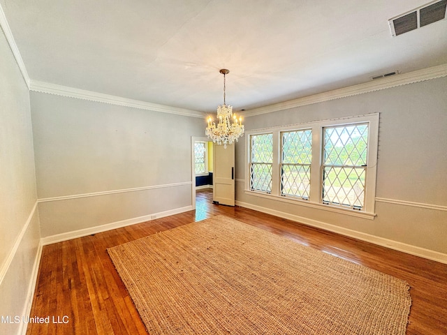 5228 Old Hwy 49, Clarksdale, MS 38614 - unfurnished room with a chandelier, wood finished floors, ornamental molding, and baseboards