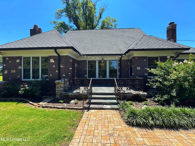 5228 Old Hwy 49, Clarksdale, MS 38614 - view of front of property with a chimney, brick siding, and a front lawn