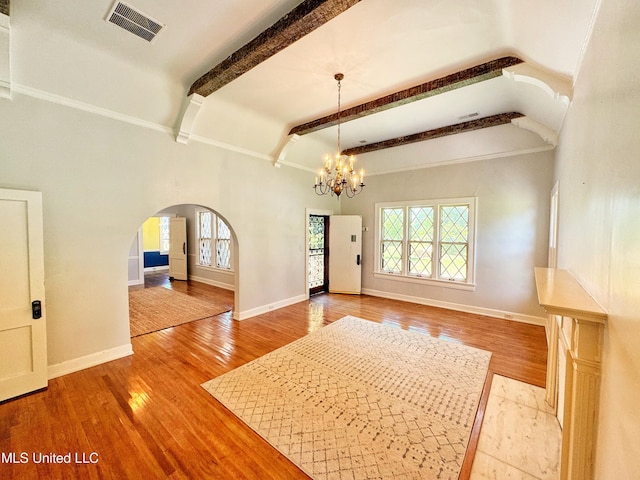 5228 Old Hwy 49, Clarksdale, MS 38614 - foyer with arched walkways, plenty of natural light, wood finished floors, and beamed ceiling