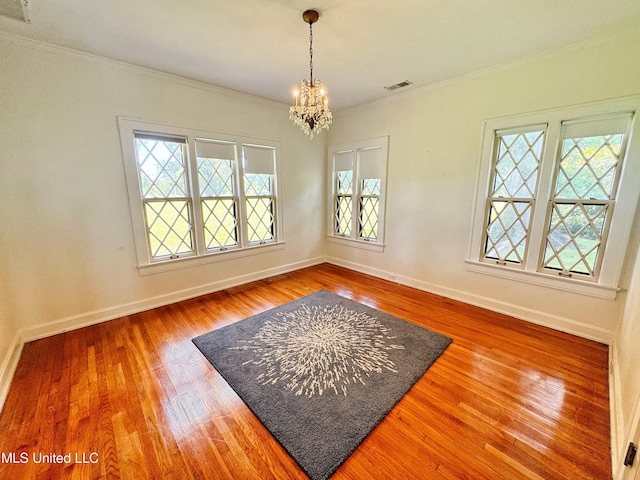 5228 Old Hwy 49, Clarksdale, MS 38614 - unfurnished room with a chandelier, wood finished floors, ornamental molding, and baseboards