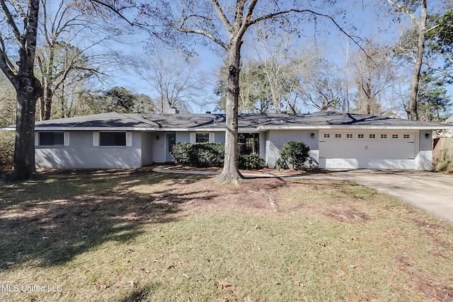 ranch-style house with a garage, concrete driveway, brick siding, and a front lawn