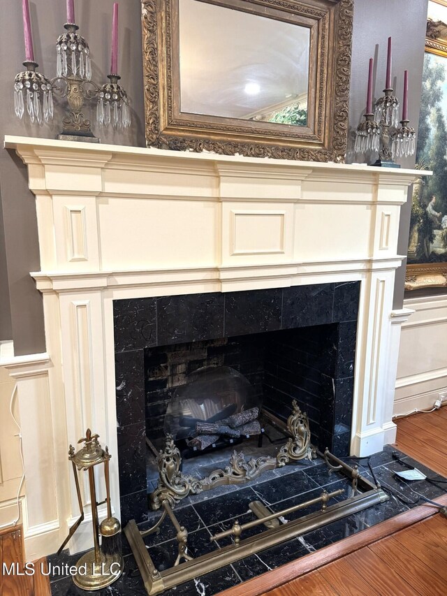 59 Dunbar Rd, Natchez, MS 39120 - detailed view of a tile fireplace and wood finished floors