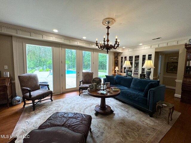 59 Dunbar Rd, Natchez, MS 39120 - living area with a chandelier, wood finished floors, french doors, and recessed lighting